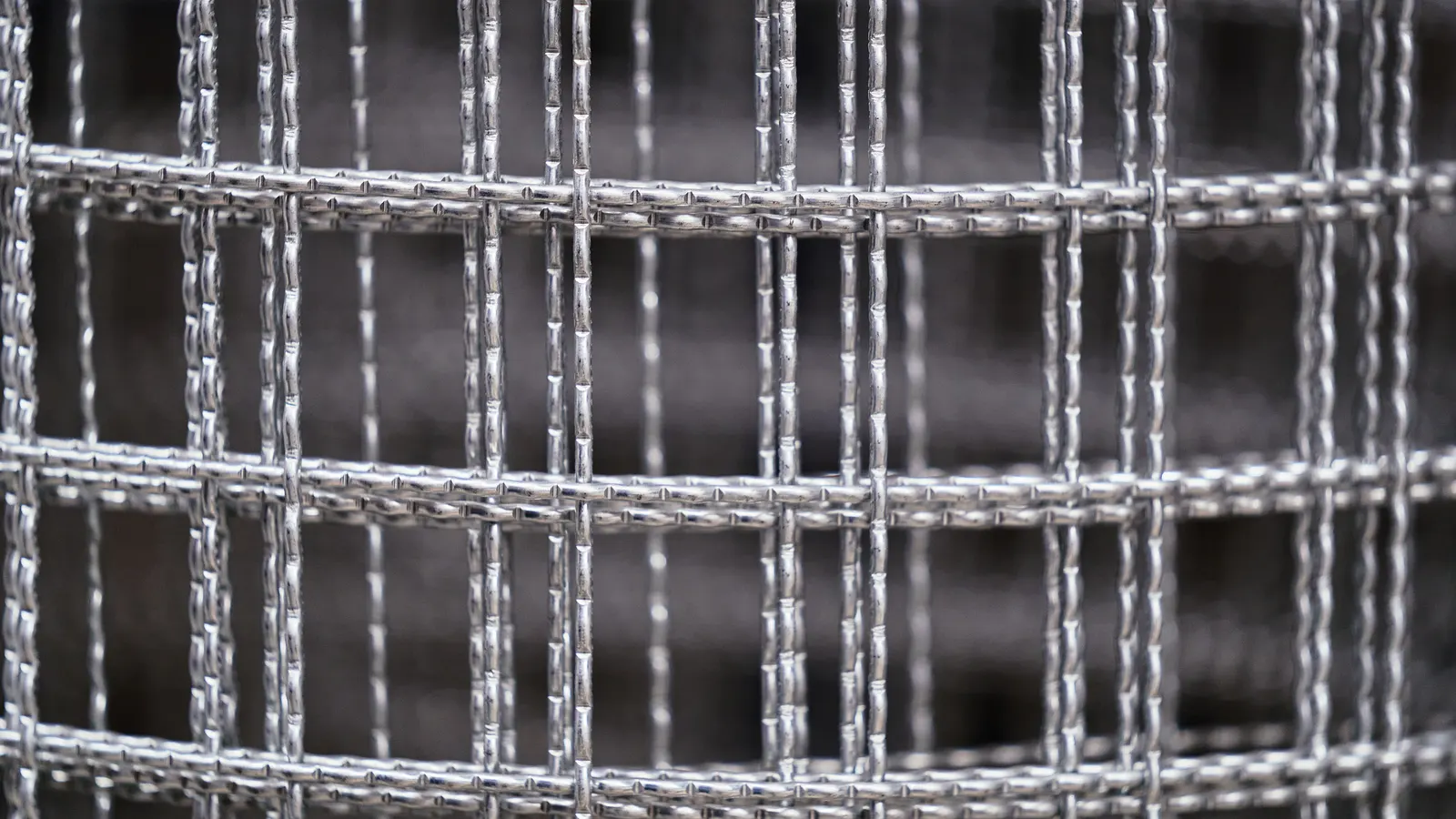 A close view of heavy galvanized wire mesh with square openings